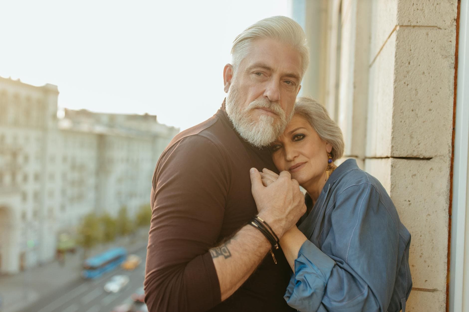 A senior couple embracing tenderly outdoors, showcasing love and connection. - maintain romance long term