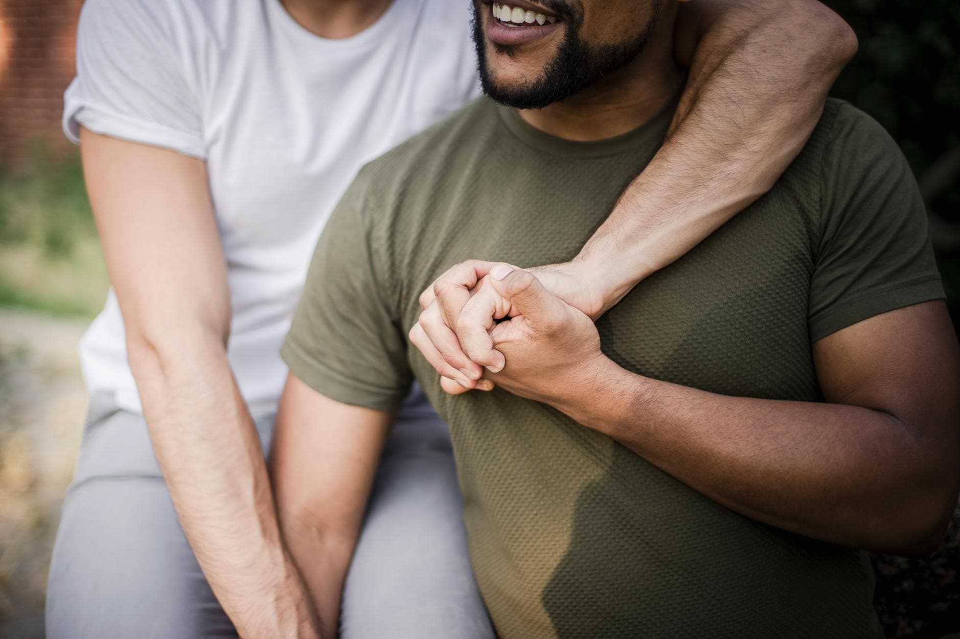 Happy couple embracing and holding hands, representing love and connection. - rebuild trust in relationship