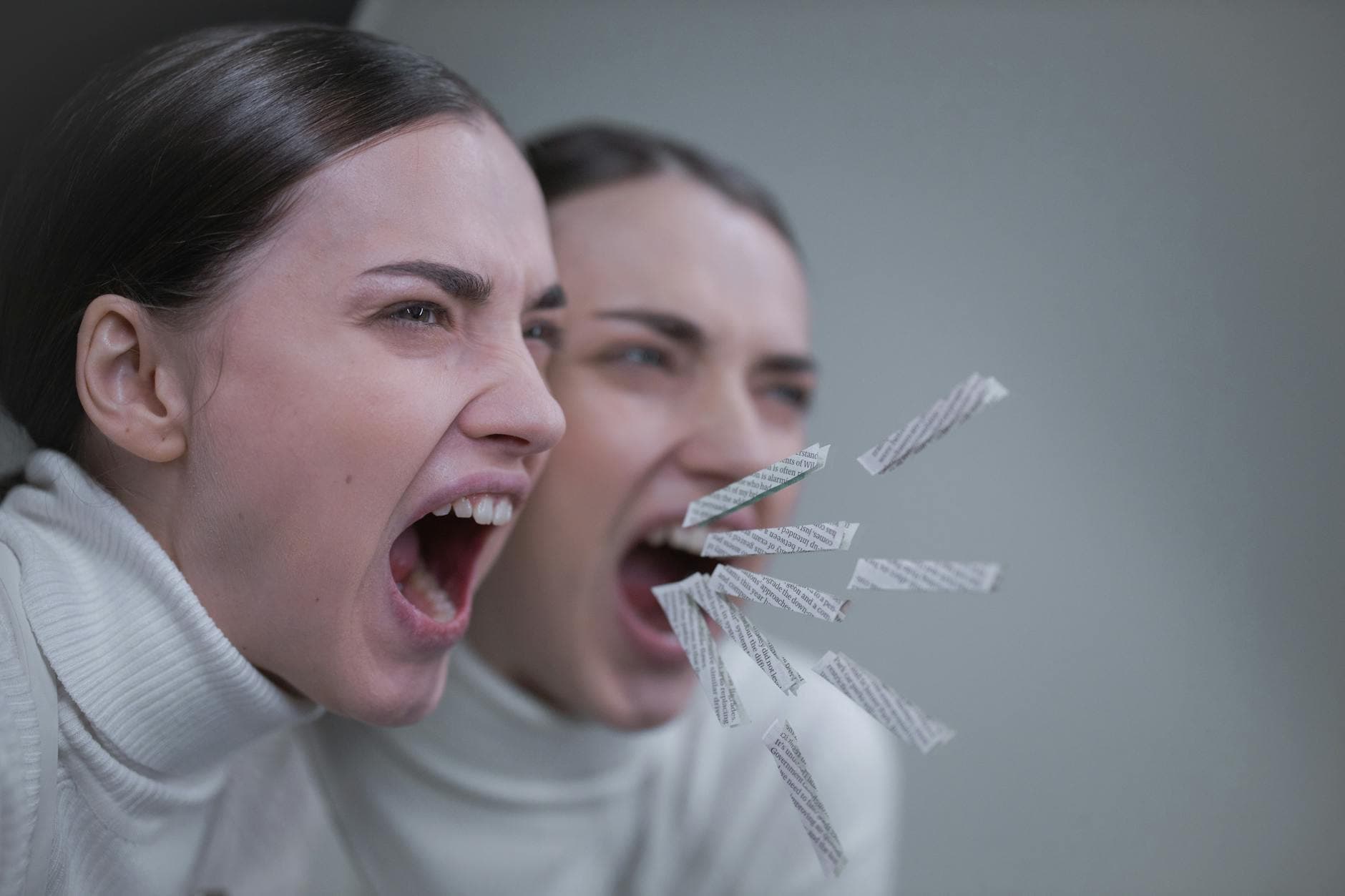 A woman passionately screaming with her reflection in a mirror, artistic concept. - allergy irritability relationship
