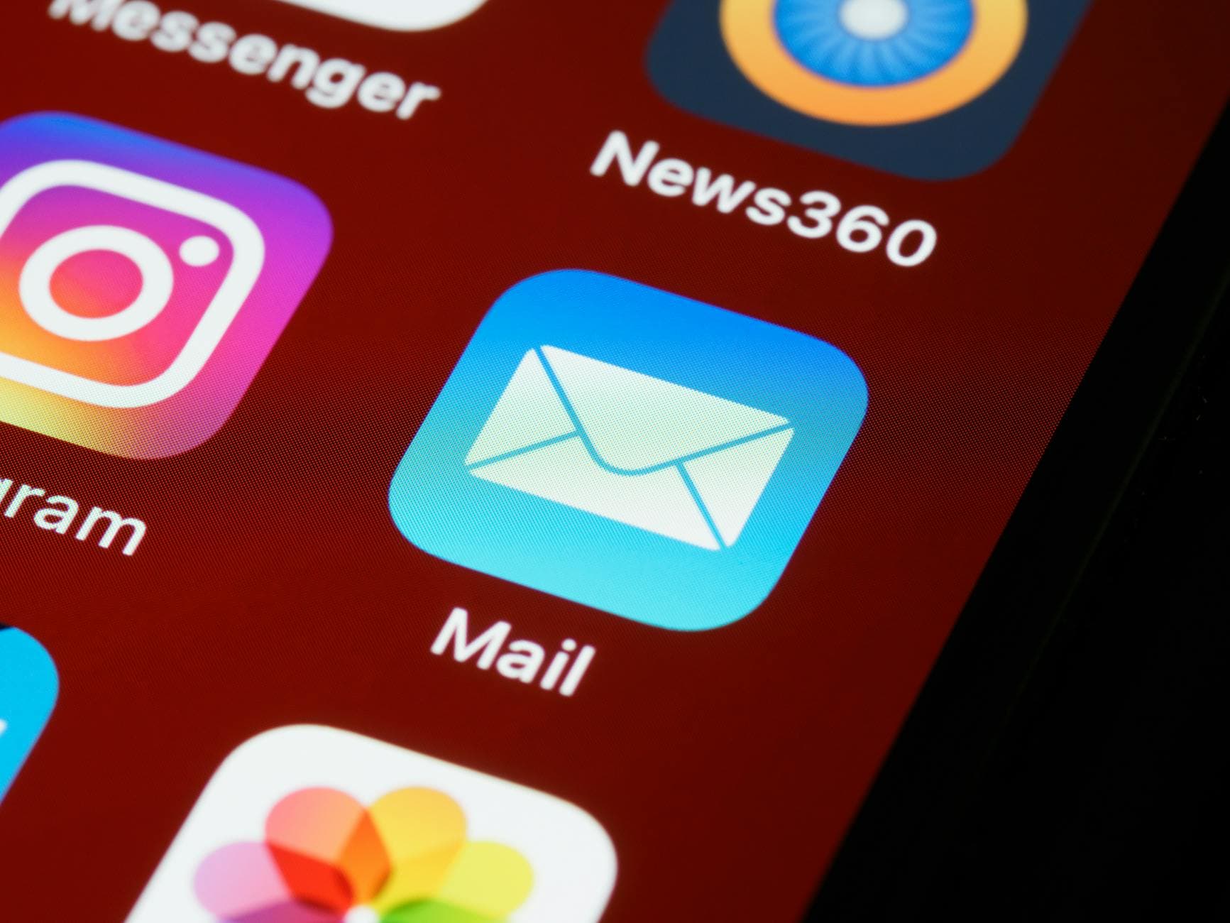 Macro shot of smartphone screen displaying various app icons including Mail and Instagram. - dating app refresh