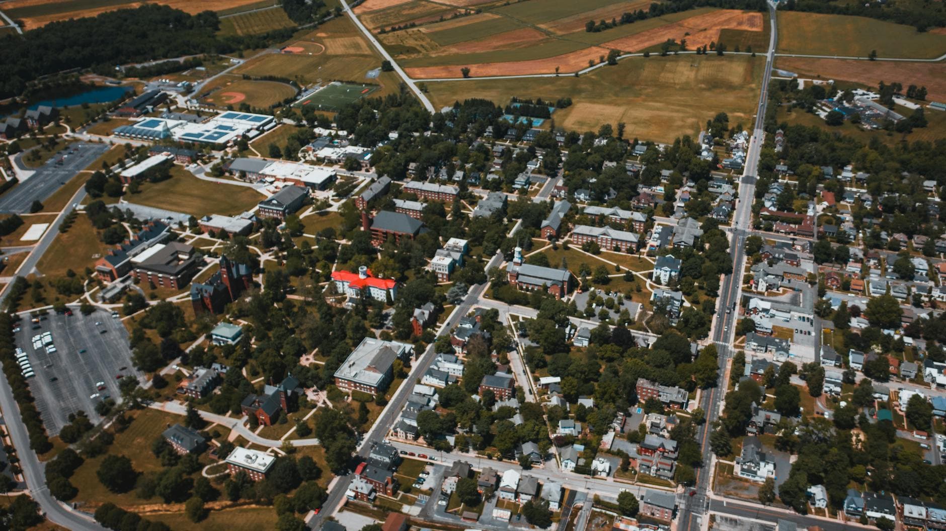 Aerial view of a suburban area in Gettysburg, PA showcasing houses, roads, and greenery. - in-law boundaries