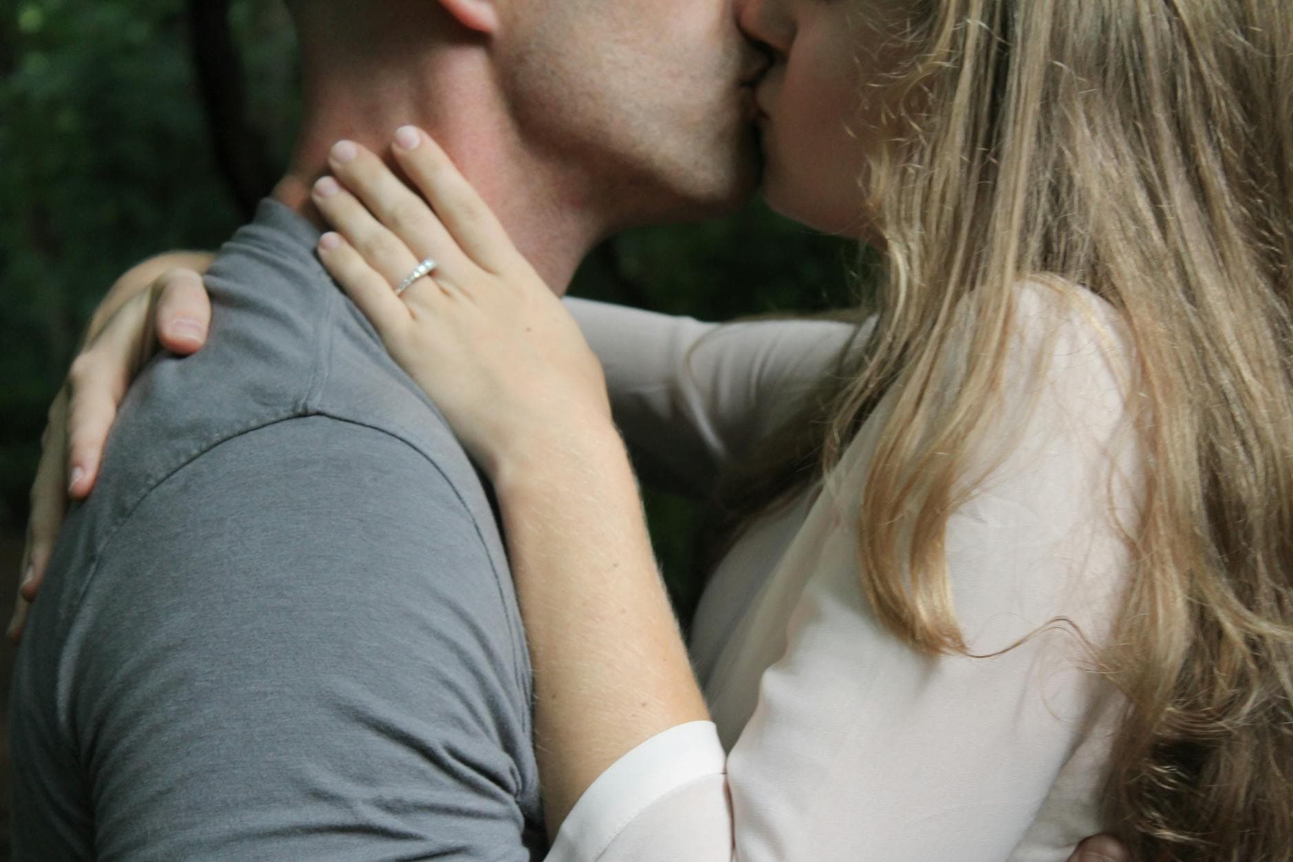 Close-up of a couple kissing outdoors, highlighting love and affection. - reignite passion relationship