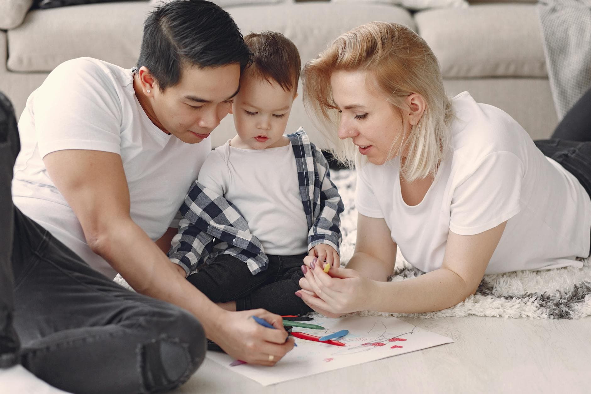 Loving family creating art together, fostering play and connection indoors. - co-parenting after divorce