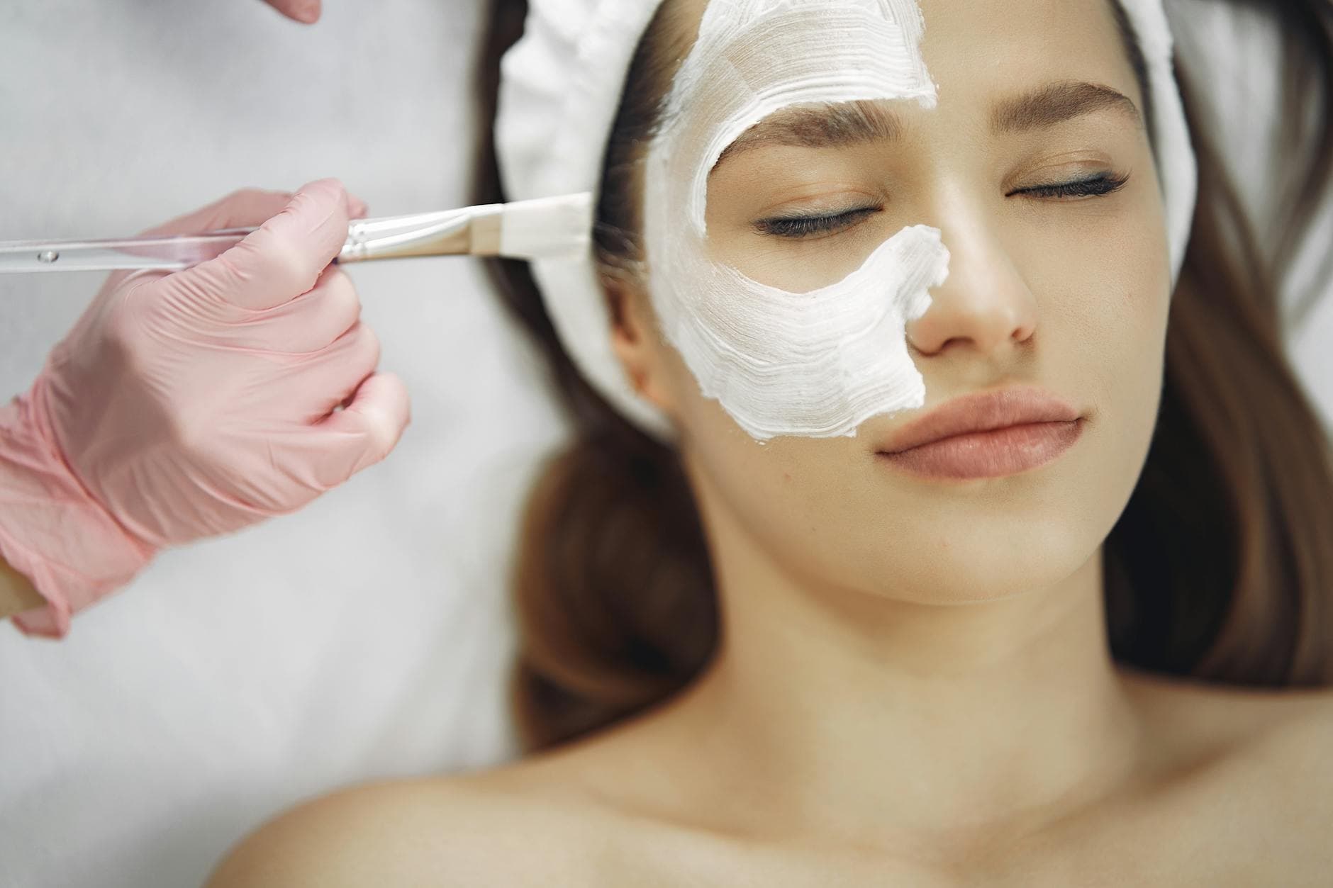 A serene spa facial treatment with a skincare mask being applied. - spring lethargy treatment