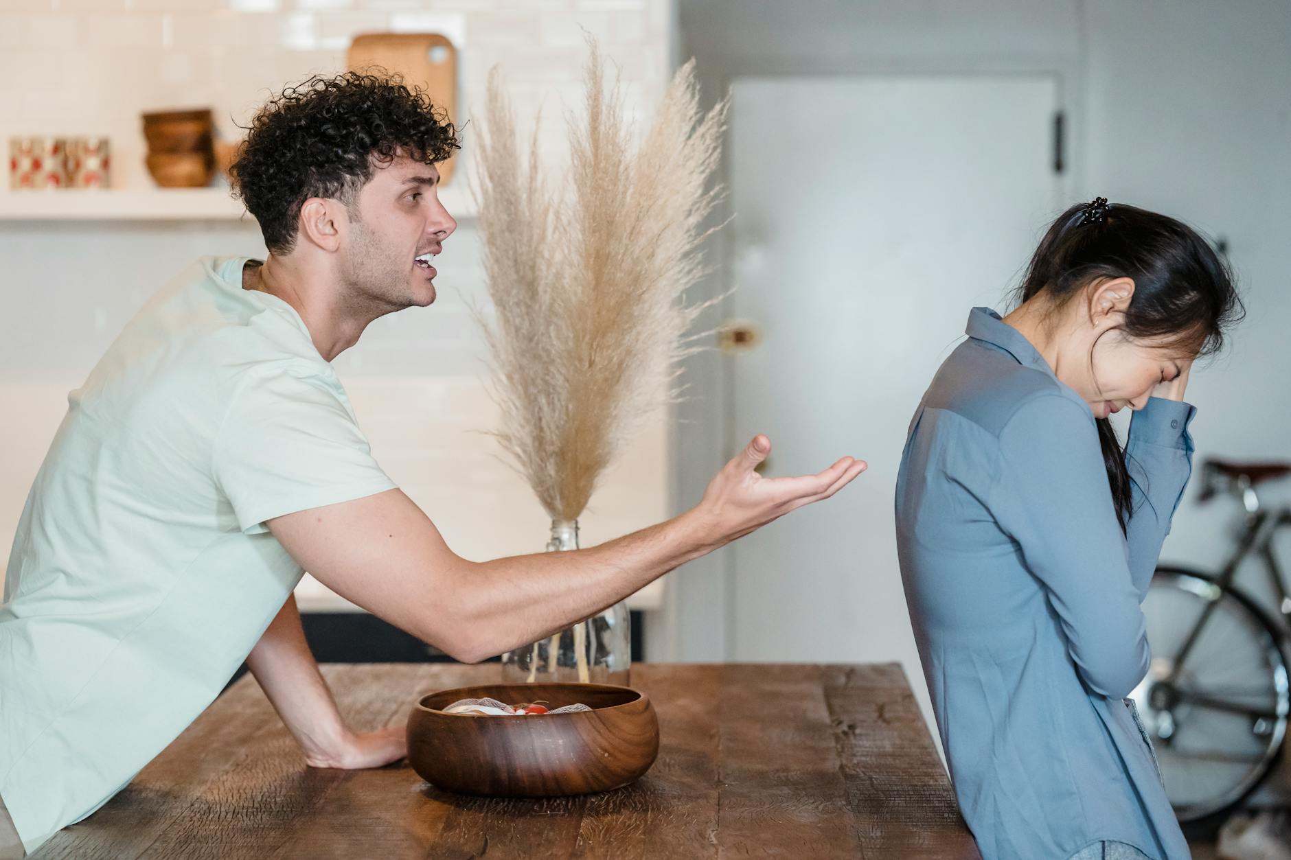 An intense argument between a couple indoors, depicting emotional distress and communication issues. - anger management cast