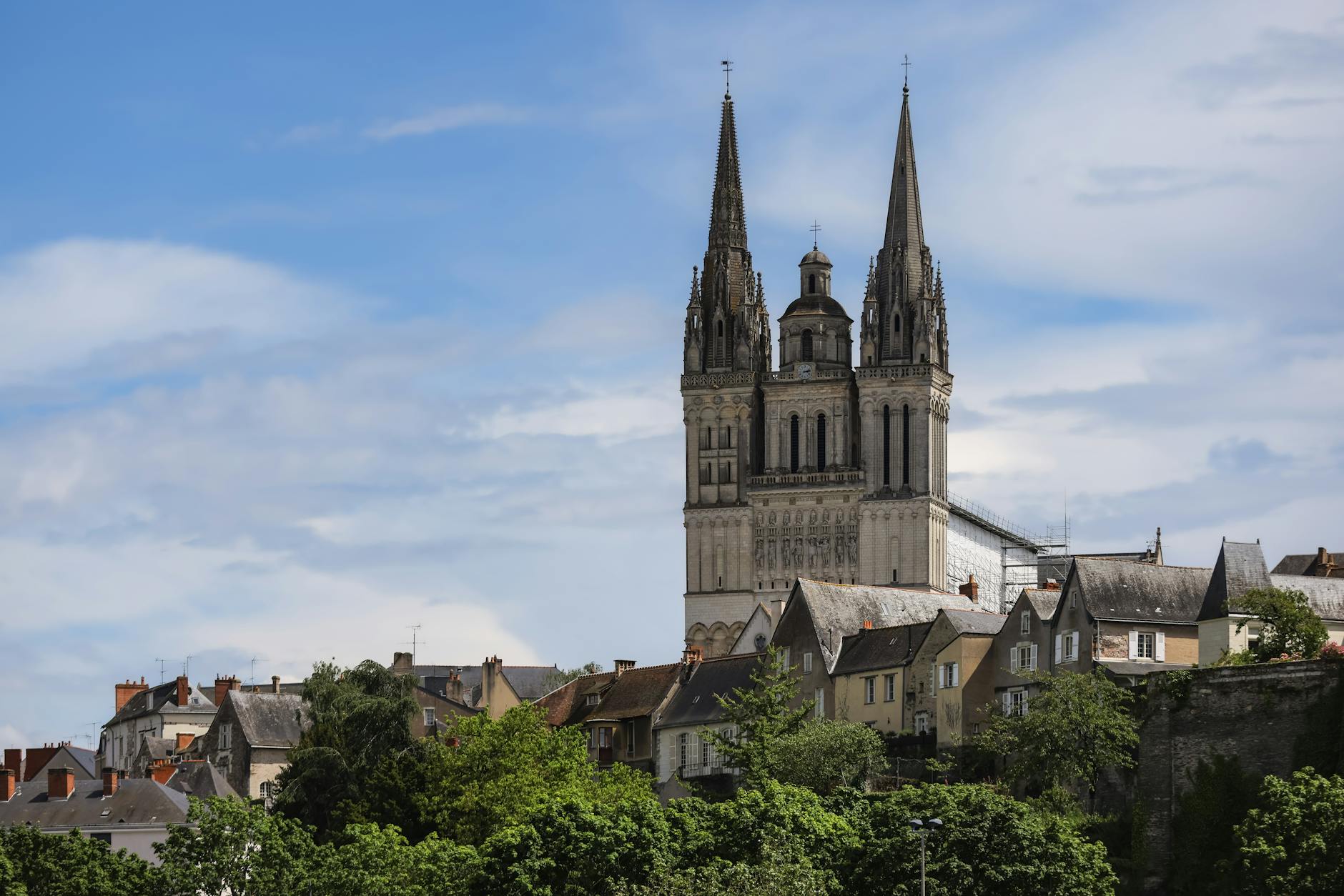Angers Cathedral's towering spires under a vibrant sky in Pays de la Loire, France. - anger management techniques