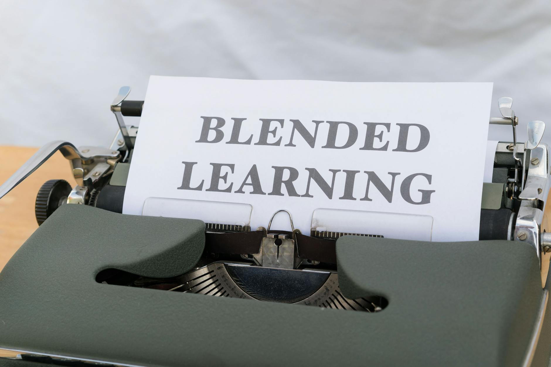 Close-up of a vintage typewriter typing 'Blended Learning', symbolizing the integration of traditional and digital education. - blended family communication strategies