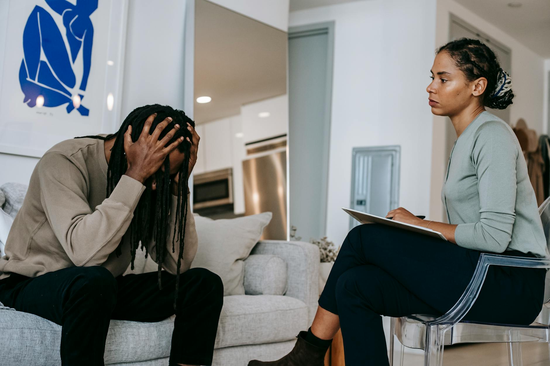 A man and a therapist in a counseling session, discussing mental health concerns. - choose therapist seasonal depression