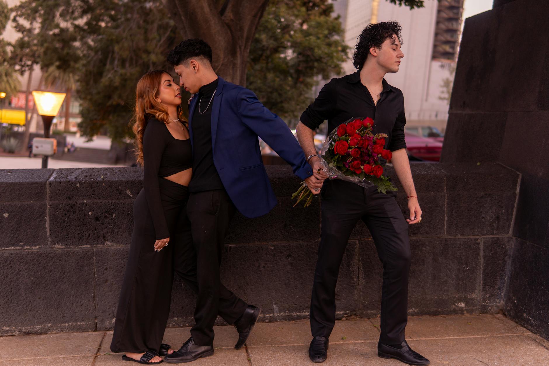 Three people caught in emotional love triangle outdoors at sunset. - couples therapy infidelity