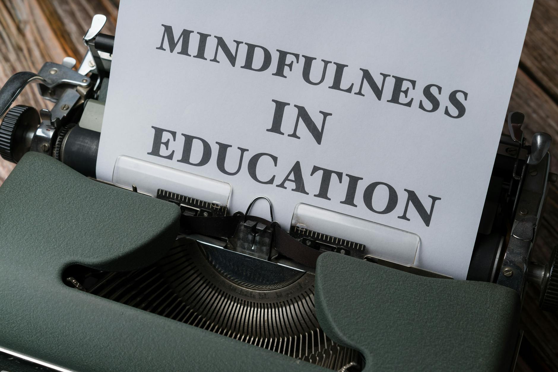 Close-up of a vintage typewriter with 'Mindfulness in Education' paper. - mindfulness for winter blues