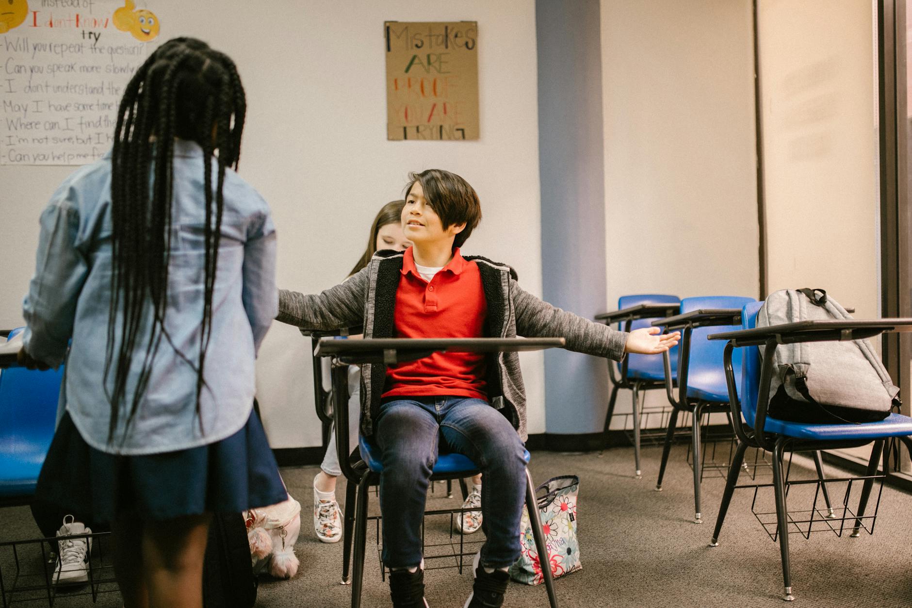 Kids in a classroom facing a tense interaction, highlighting the importance of empathy and understanding. - winter social skills for kids