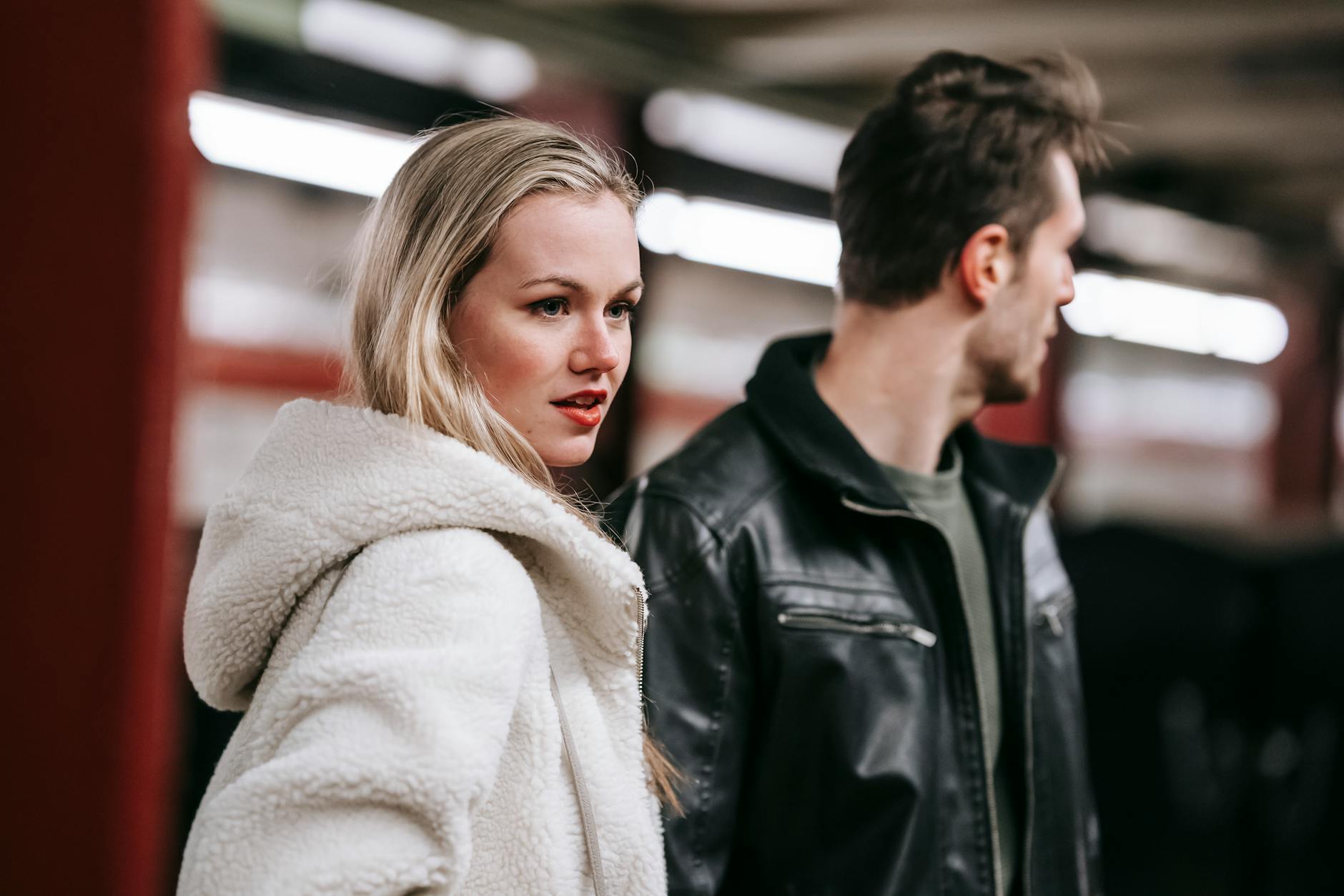 Stylish couple at an underground metro station, showcasing urban lifestyle and relationship. - avoidant attachment style
