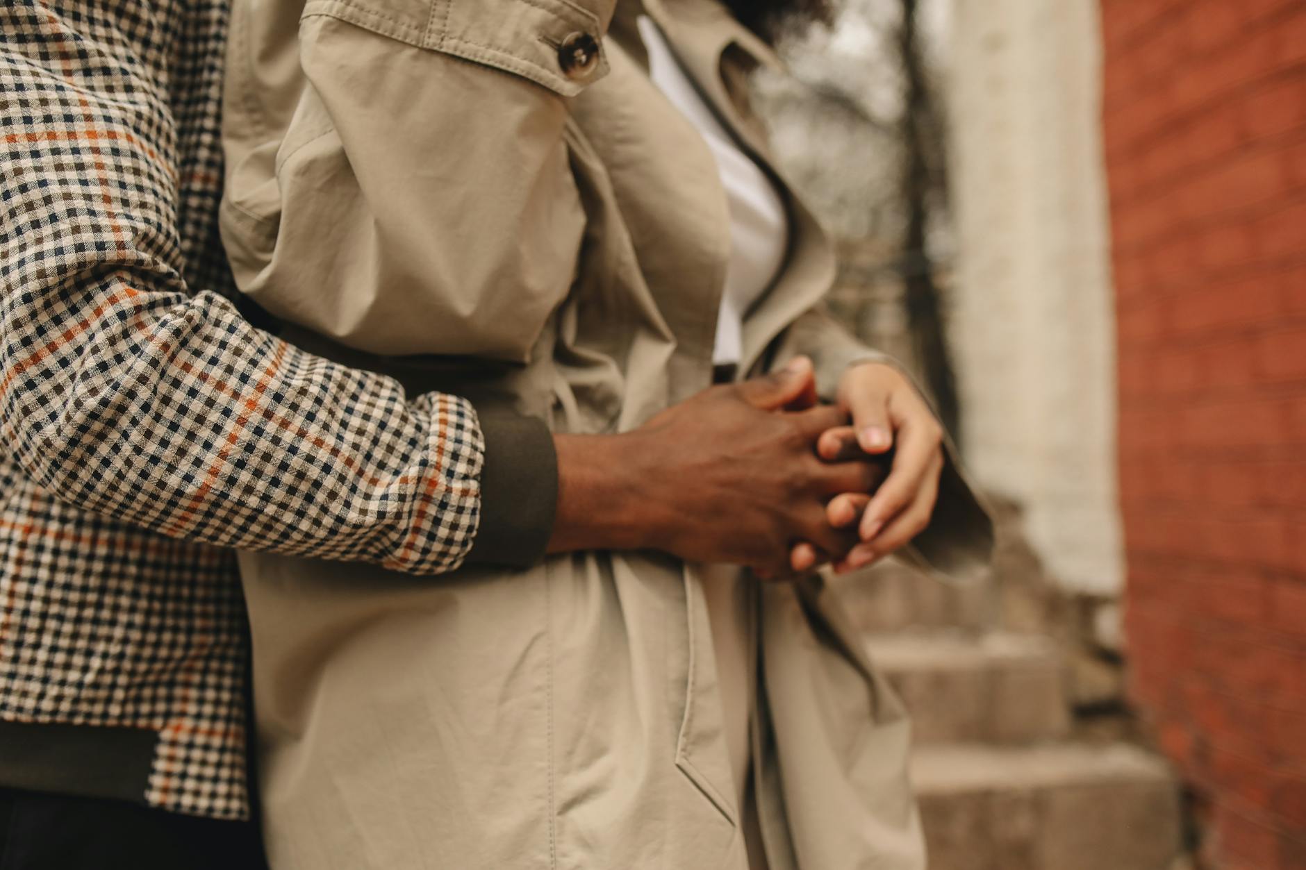 An intimate close-up of a couple embracing, showcasing togetherness and love. - build trust relationships