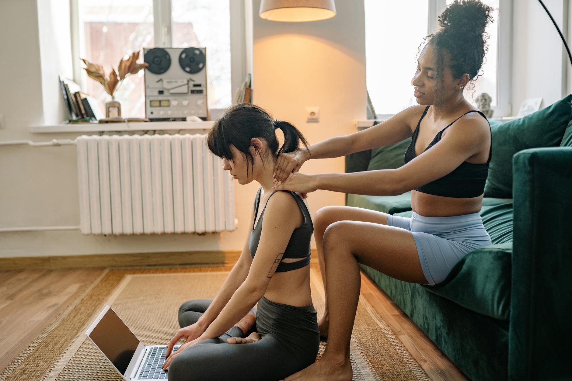 Two women in sportswear enjoying relaxation and comfort indoors, focusing on mental well-being. - couples therapy february