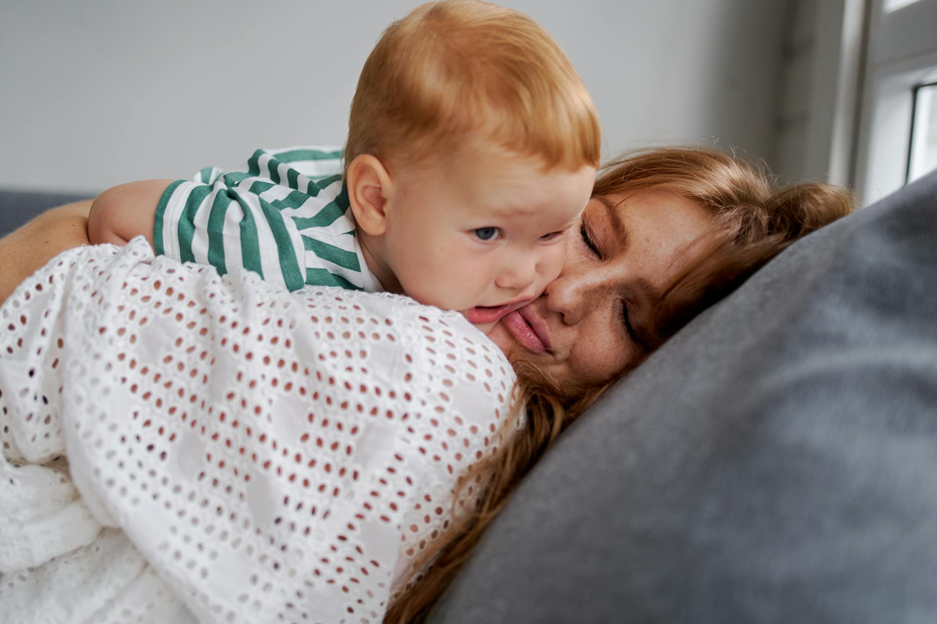 A mother and child enjoying a peaceful moment together on a cozy sofa. - disorganized attachment