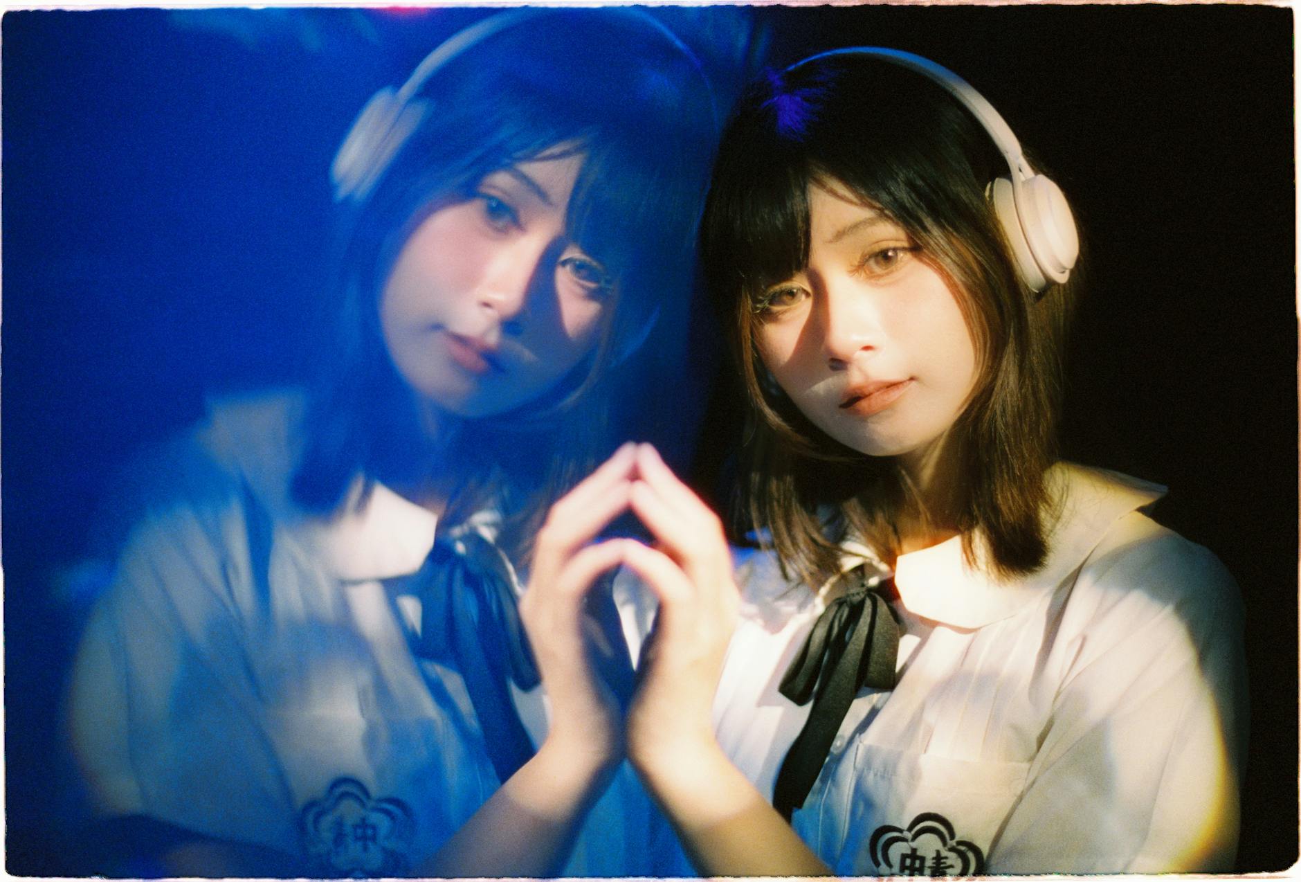 Artistic portrait of a girl with headphones, showing a reflective and serene expression. - effective listening skills