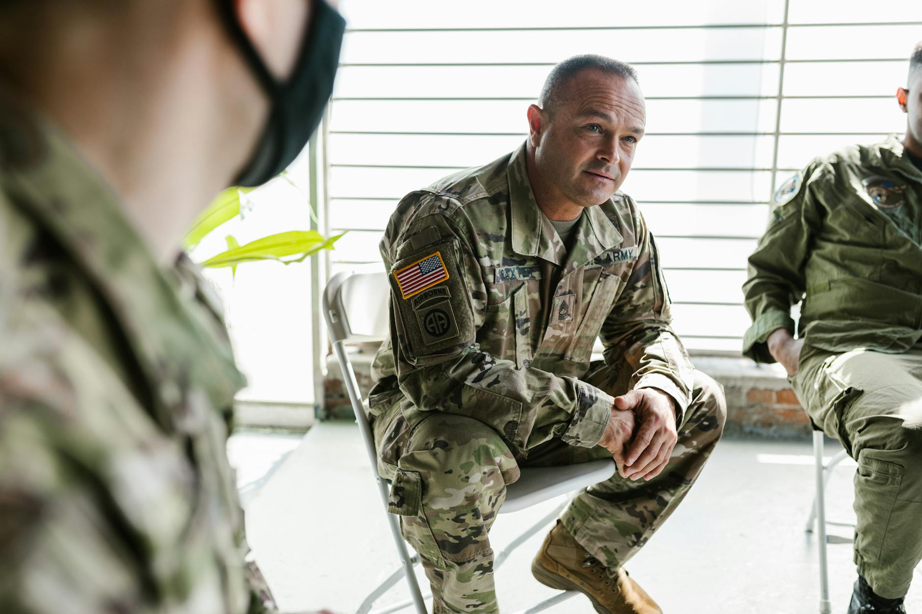 Military veterans participate in a group therapy session to support mental health recovery. - effective listening skills