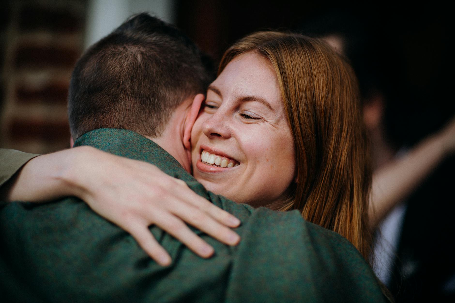 A woman joyfully embracing a man, expressing happiness and warmth. - express gratitude relationships