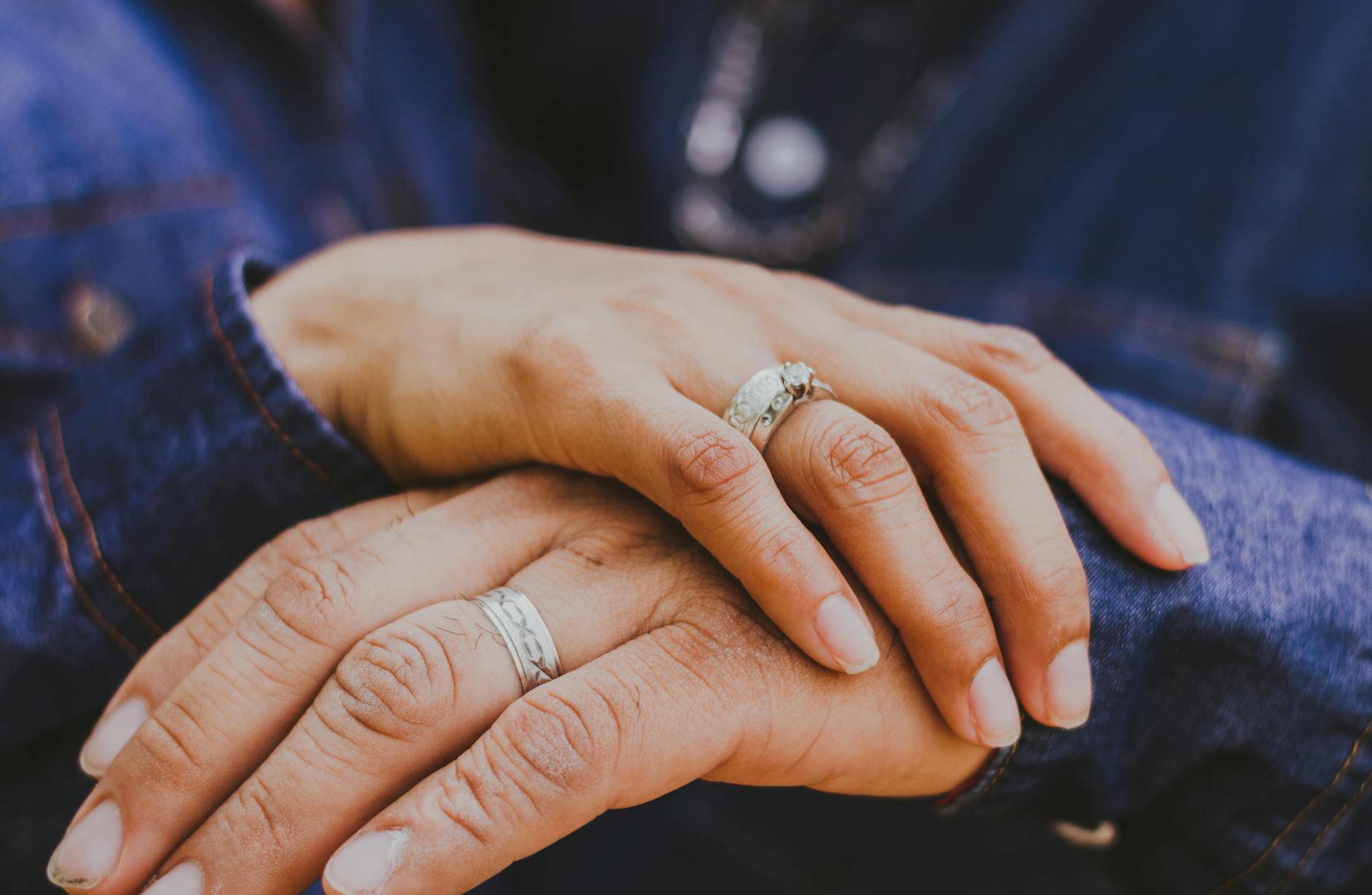 Intimate close-up of couple's hands with wedding rings, symbolizing love and commitment. - gratitude in marriage