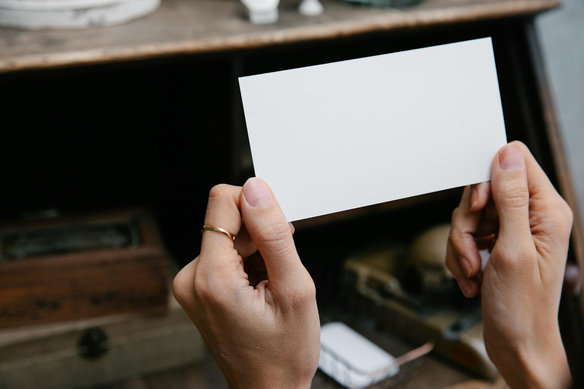 A blank rectangular card is held by hands, offering copy space for text or design. - marriage advice cards