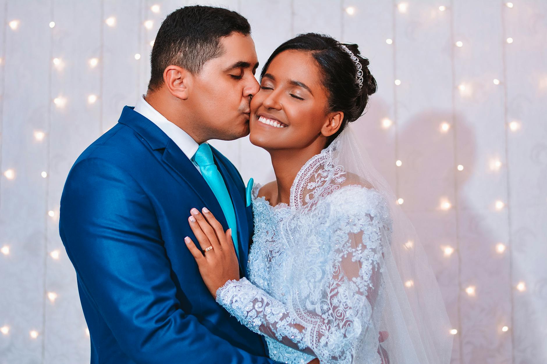 A joyful bride and groom embrace in a romantic wedding portrait. - marriage advice women
