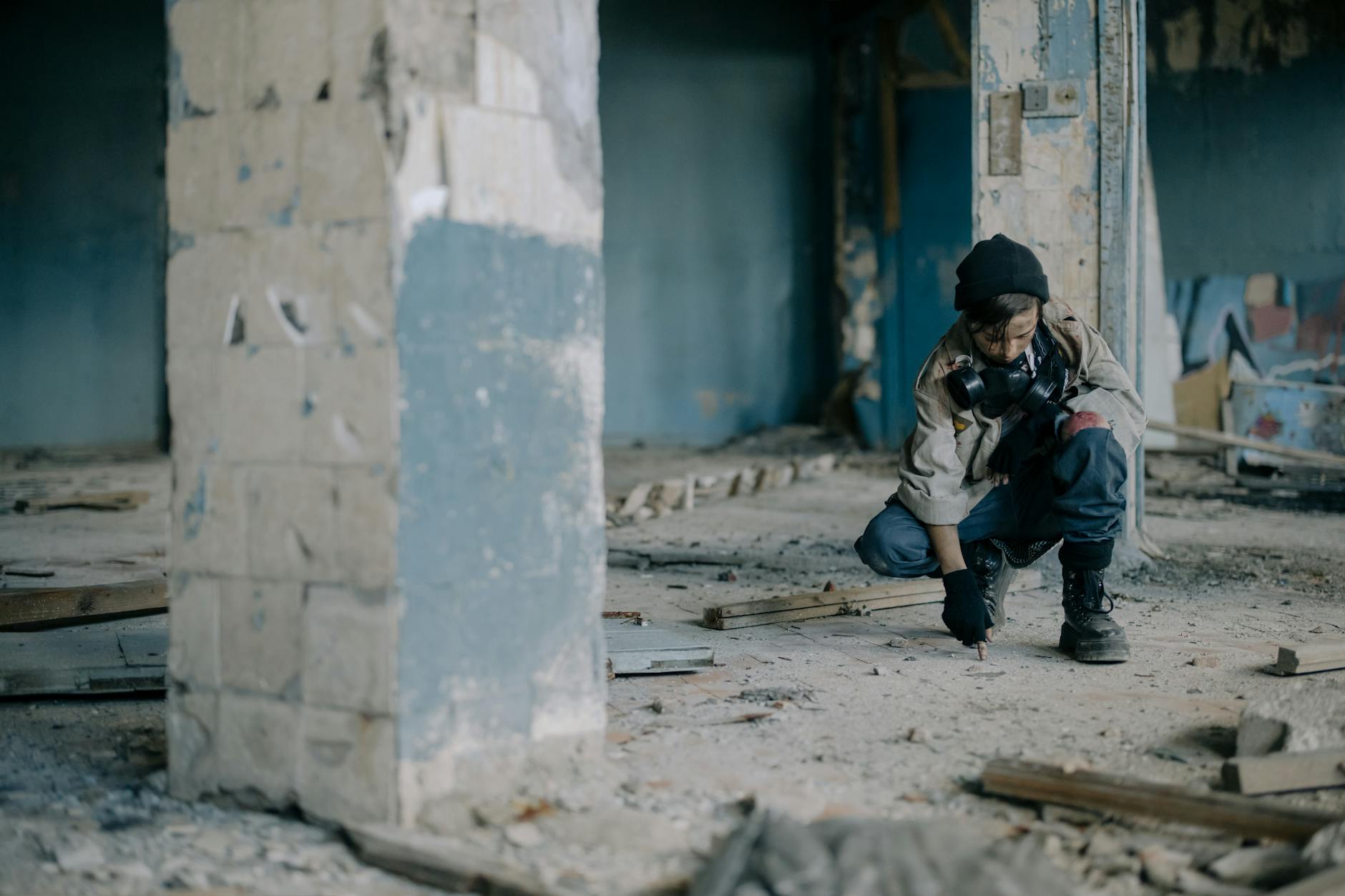 A young person exploring a desolate, abandoned building, conveying adventure and survival. - post winter loneliness