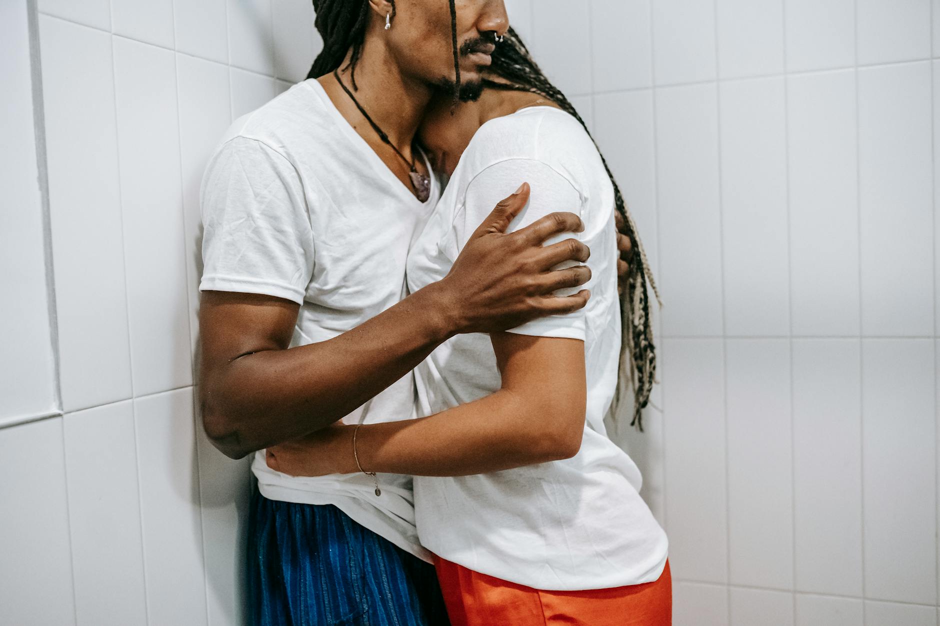 A couple shares a tender embrace indoors, reflecting affection and calmness. - rebuilding trust couples
