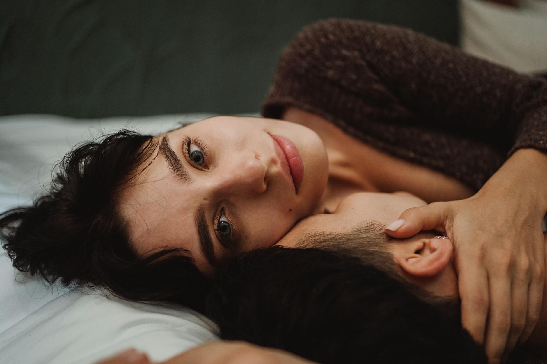 Close-up of a couple embracing, showcasing intimacy and emotional connection indoors. - rekindle intimacy long term relationships