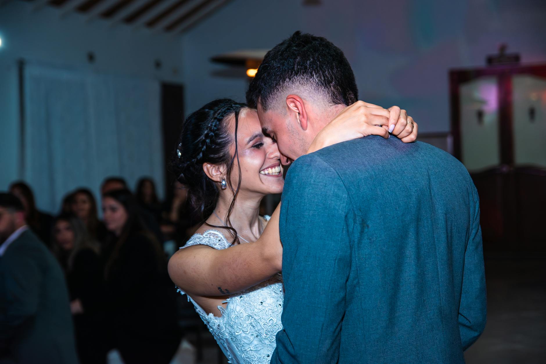Joyful bride and groom embrace during their wedding dance at a lively celebration. - rekindle marital intimacy