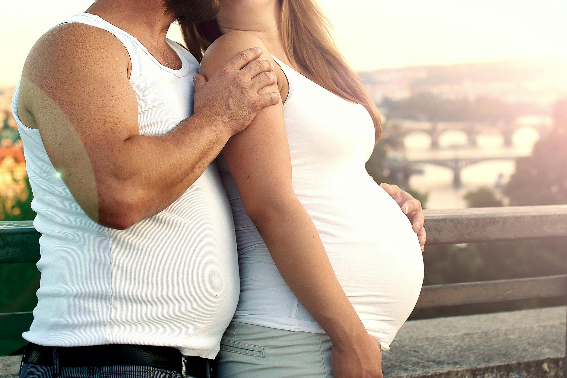 A couple lovingly embraces outdoors with a scenic background. - reset relationship expectations