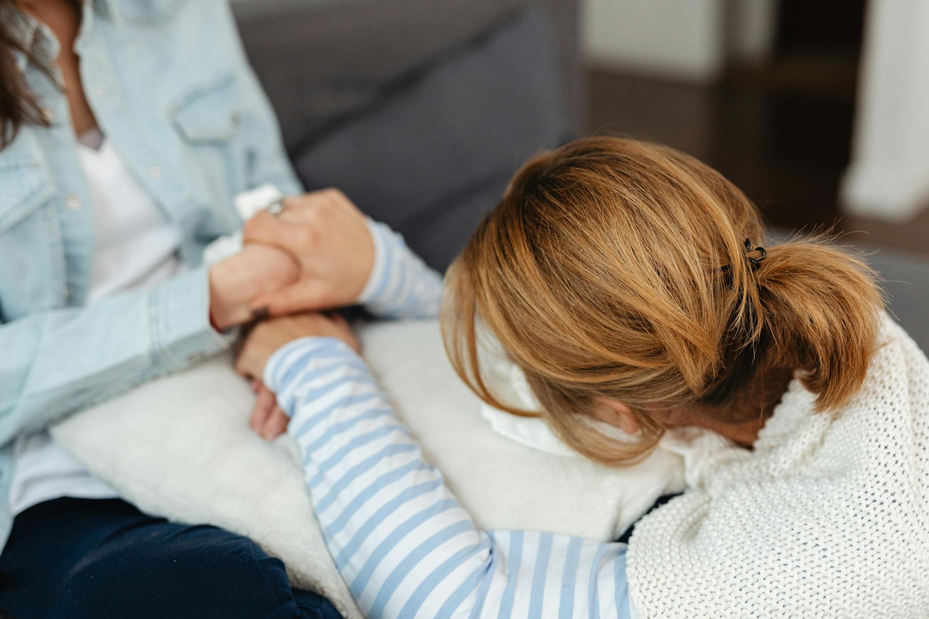 Two women share a comforting moment, emphasizing support and empathy in emotional distress. - self compassion mental health