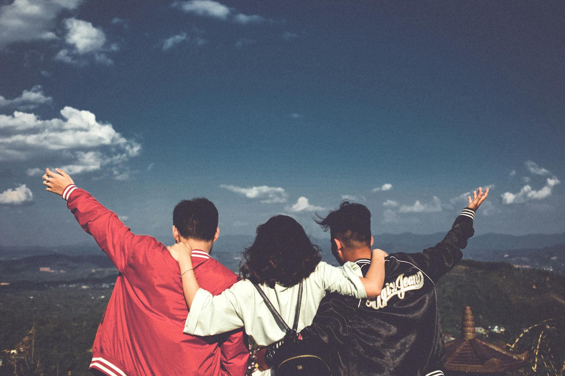 A joyful moment with friends overlooking a scenic landscape in Gia Lai, Vietnam. - spring break activities