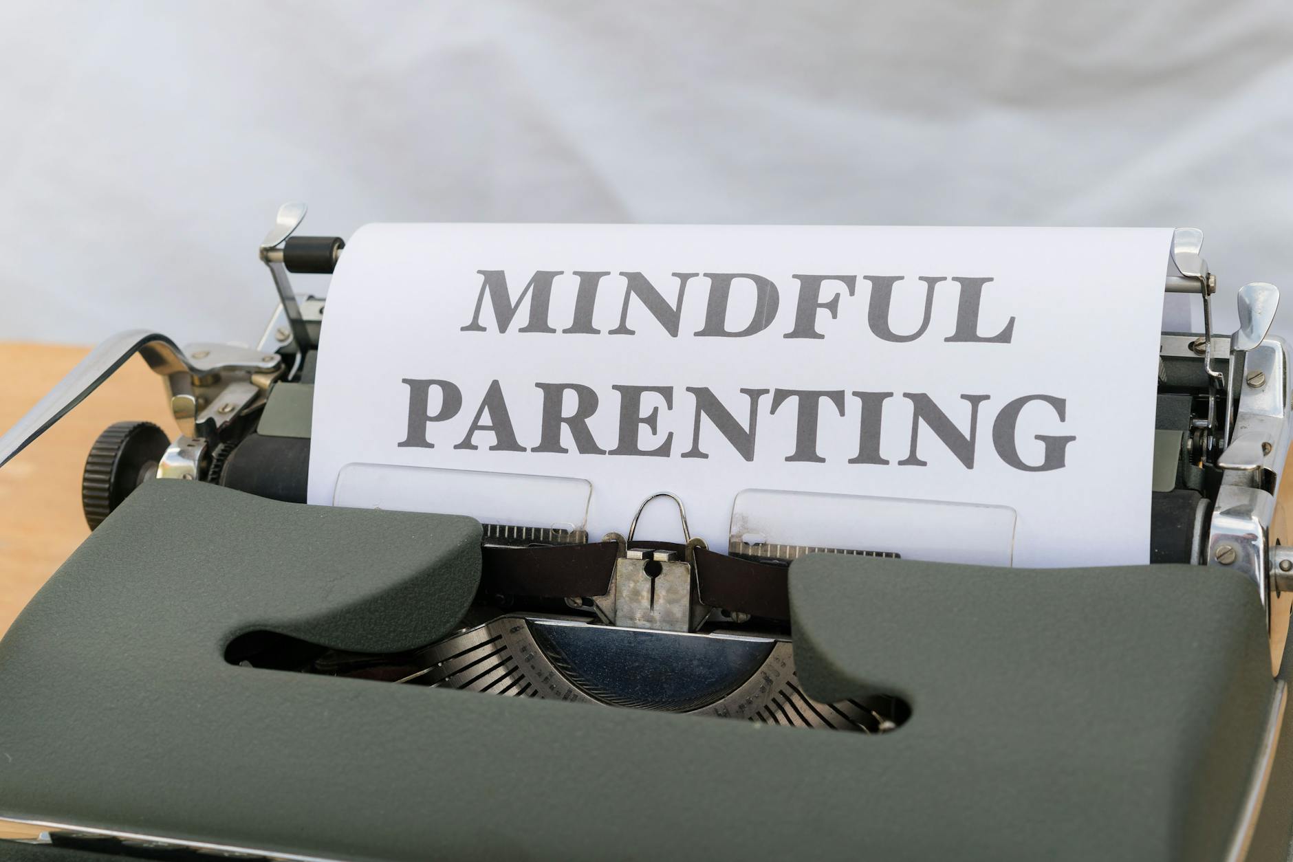 A close-up of a vintage typewriter displaying the message 'Mindful Parenting'. - spring lethargy mindfulness