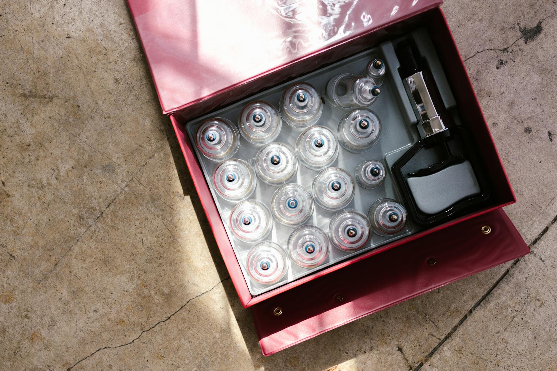 A top view of a cupping therapy set within a red box, ideal for healthcare enthusiasts. - spring overwhelm therapy