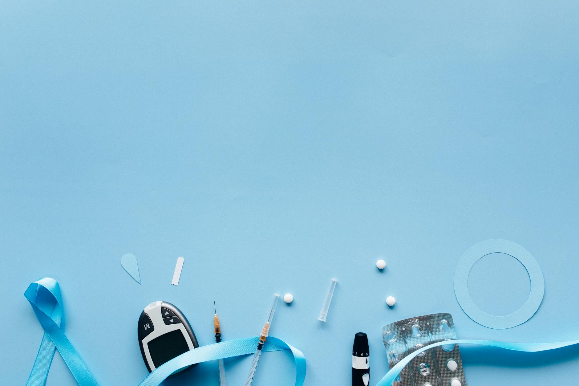 Flat lay of diabetes awareness items and medical tools on a blue background. Ideal for health campaigns. - winter blues treatment