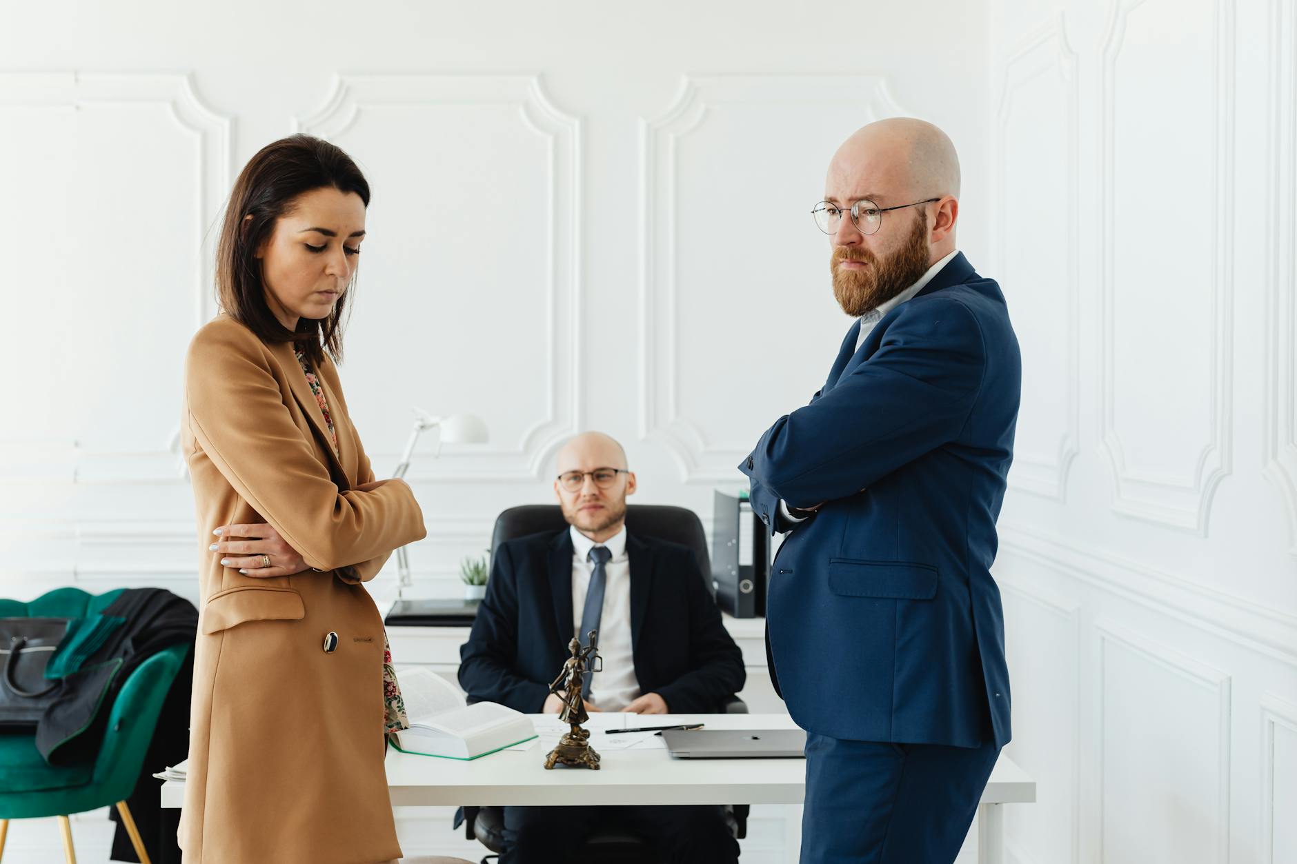 A couple in corporate attire seeks mediation during a business disagreement in an office setting. - are workplace relationships legal