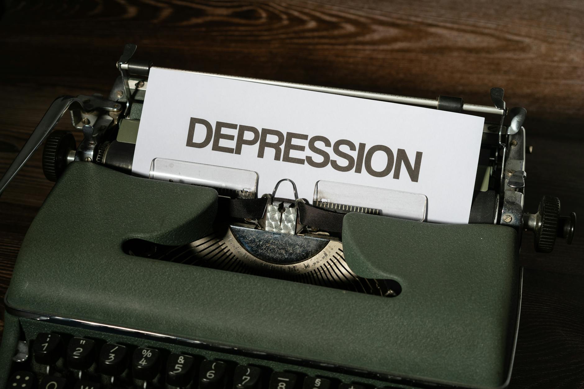 A vintage typewriter with the word 'Depression' typed on paper, conveying a mental health theme. - sad treatment options