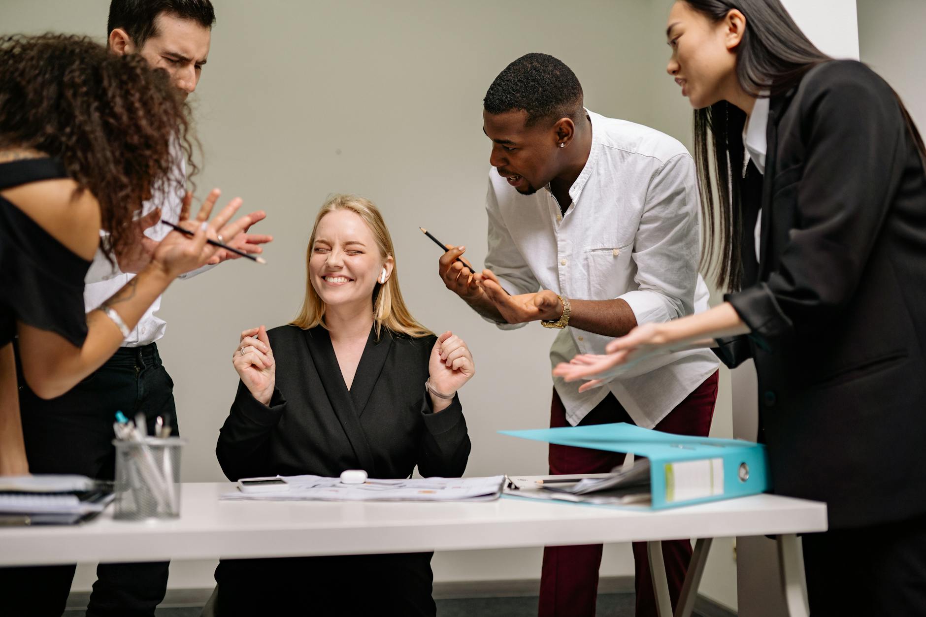 A lively and diverse team collaborates in a modern office setting. Vibrant discussion and teamwork. - emotional organization