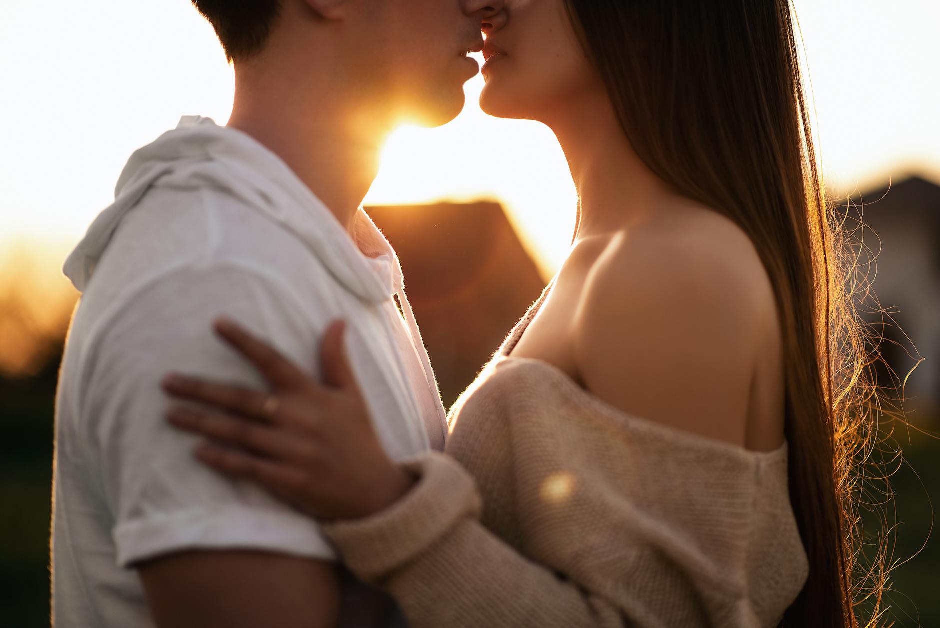 A romantic moment between a couple sharing an intimate embrace at sunset. - rekindle relationship passion