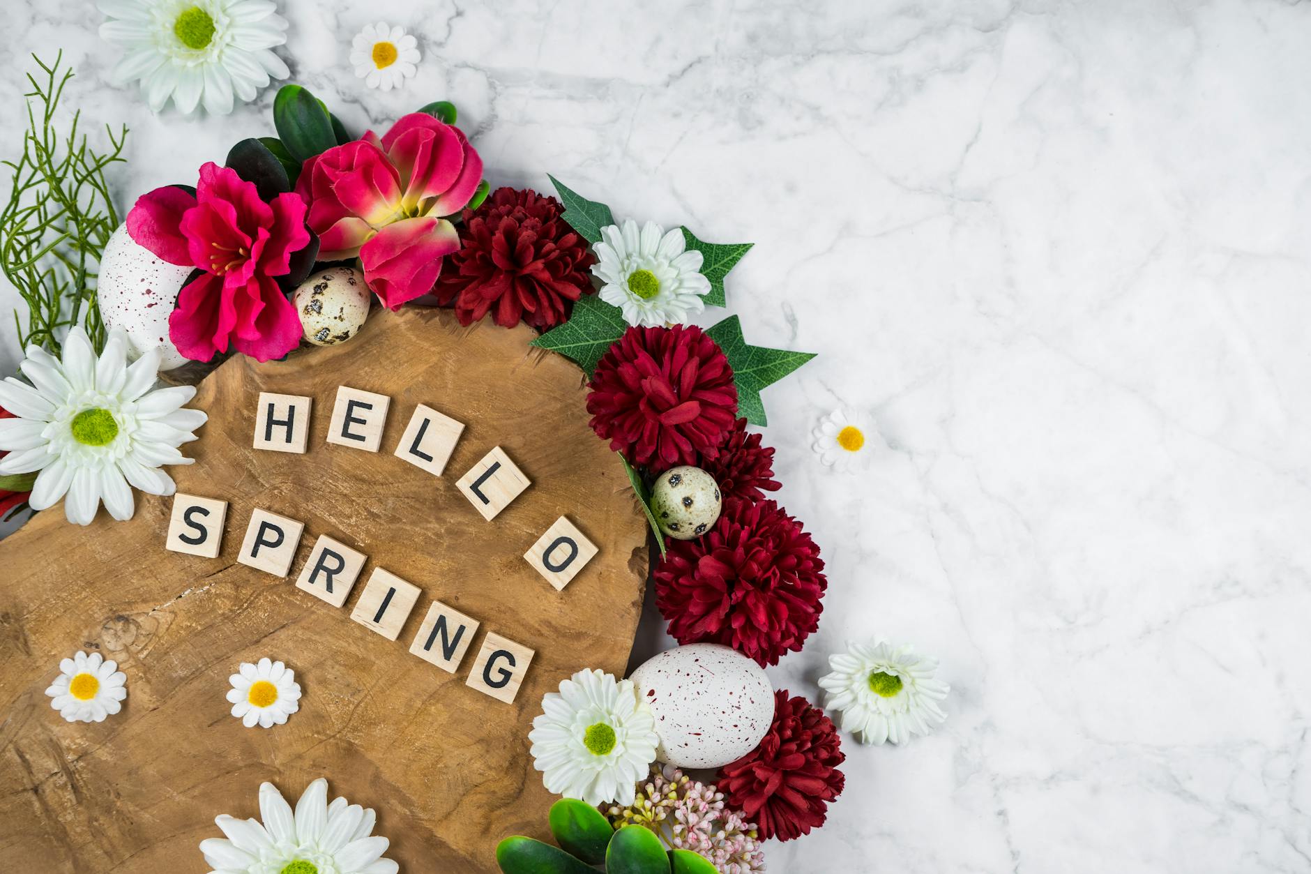 Bright floral arrangement with eggs on wood, signaling spring's arrival. - spring slump therapy
